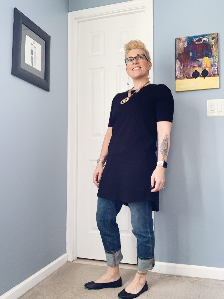Eileen Fisher black organic cotton shift dress, chicos jeans and necklace with tieks ballet flats in matte black.
