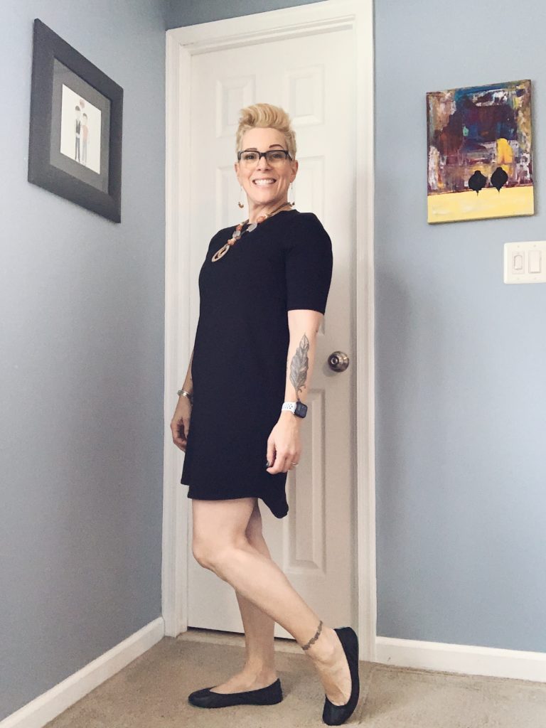 Eileen Fisher organic cotton black shift dress with necklace from chicos and Tieks ballet flats in matte black.