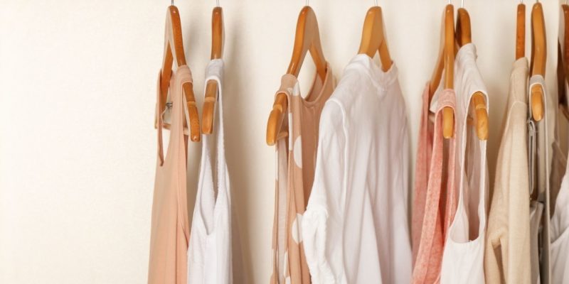 neutral clothing on a rack