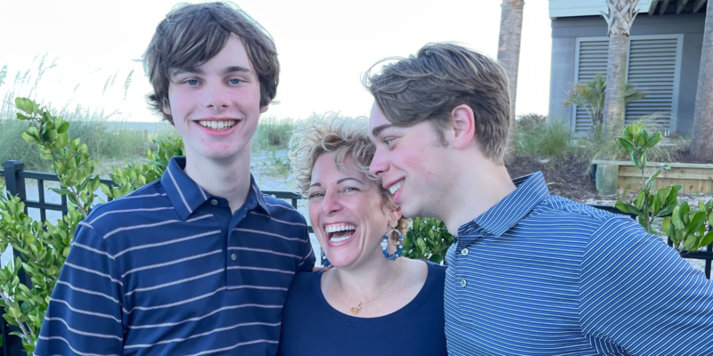 Gretchen Schock hugging and laughing with her two teenagers